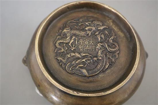 A Chinese bronze censer with lion mask handles, Xuande mark, but later, diameter 16cm